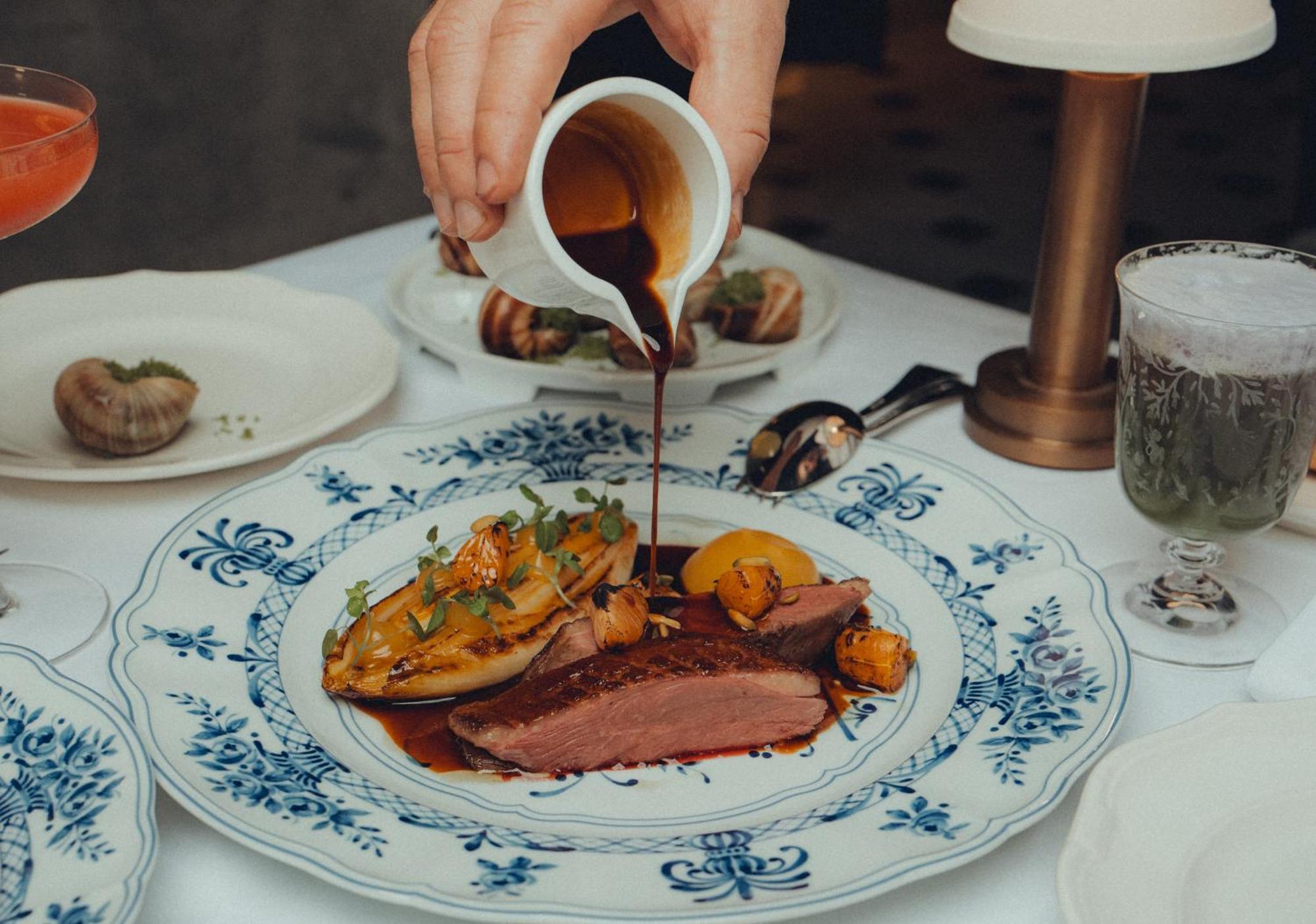 Five Luxe Hotel Dubai Bagian luar foto A duck dish at the restaurant